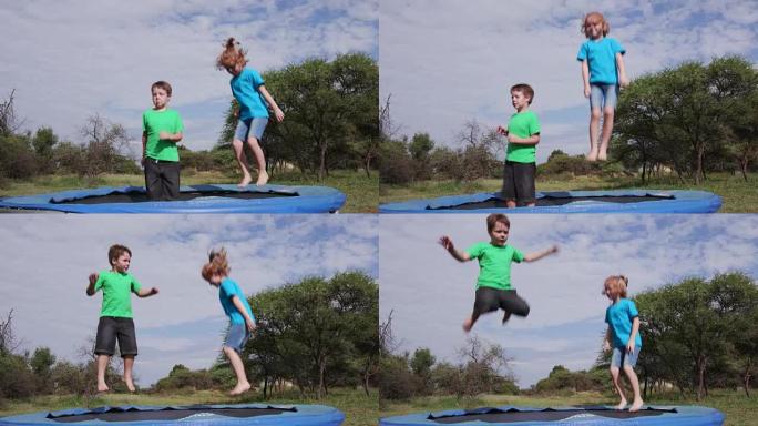 4k两个快乐的孩子在蹦床上跳跃
