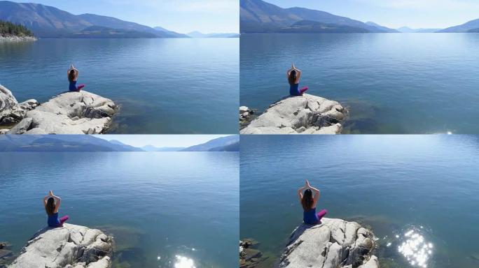 女子在4k湖岸表演瑜伽