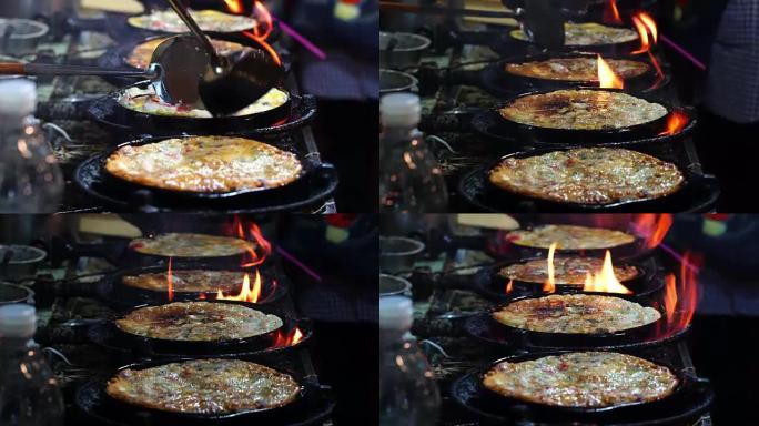 4k特写镜头，用平底锅上的平底锅铁锹炒虾，泰国传统食品，亚洲食品