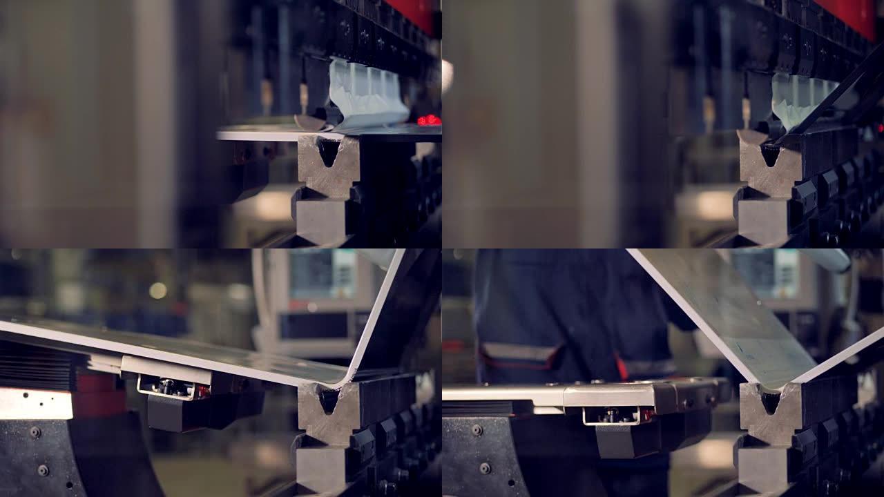 金属折弯机。金属加工工业设备弯曲金属板。