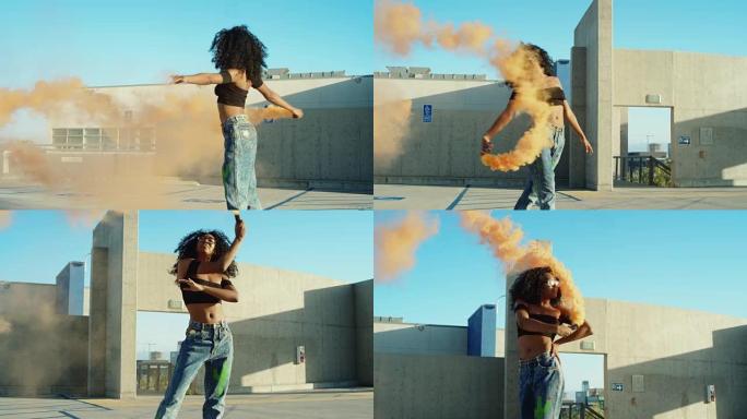 日落时分，年轻女子在屋顶停车场的烟雾手榴弹在外面跳舞