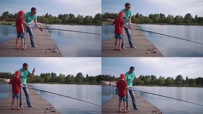 父亲和儿子在木制码头钓鱼
