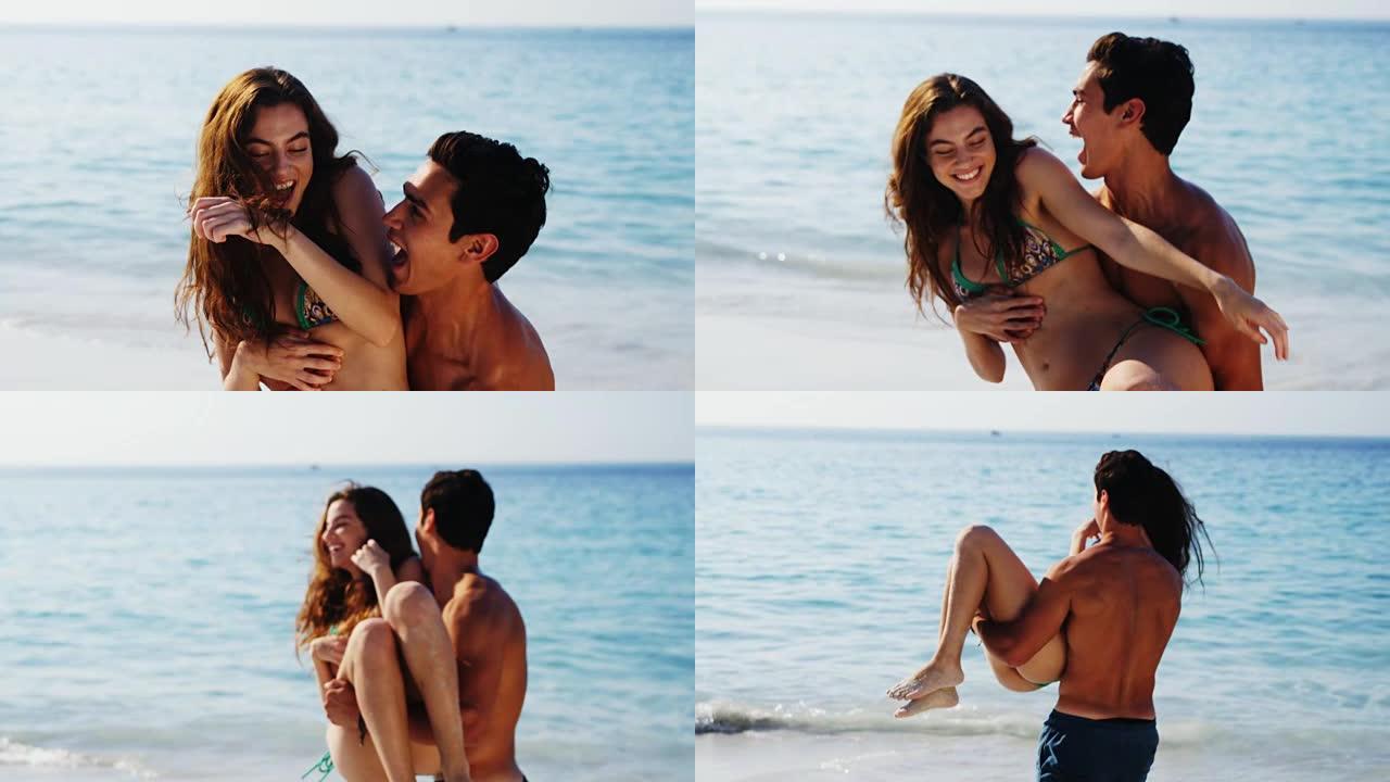 浪漫的情侣在海滩玩得开心