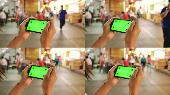 色度键: 时髦女孩在街上用智能手机拍照。
