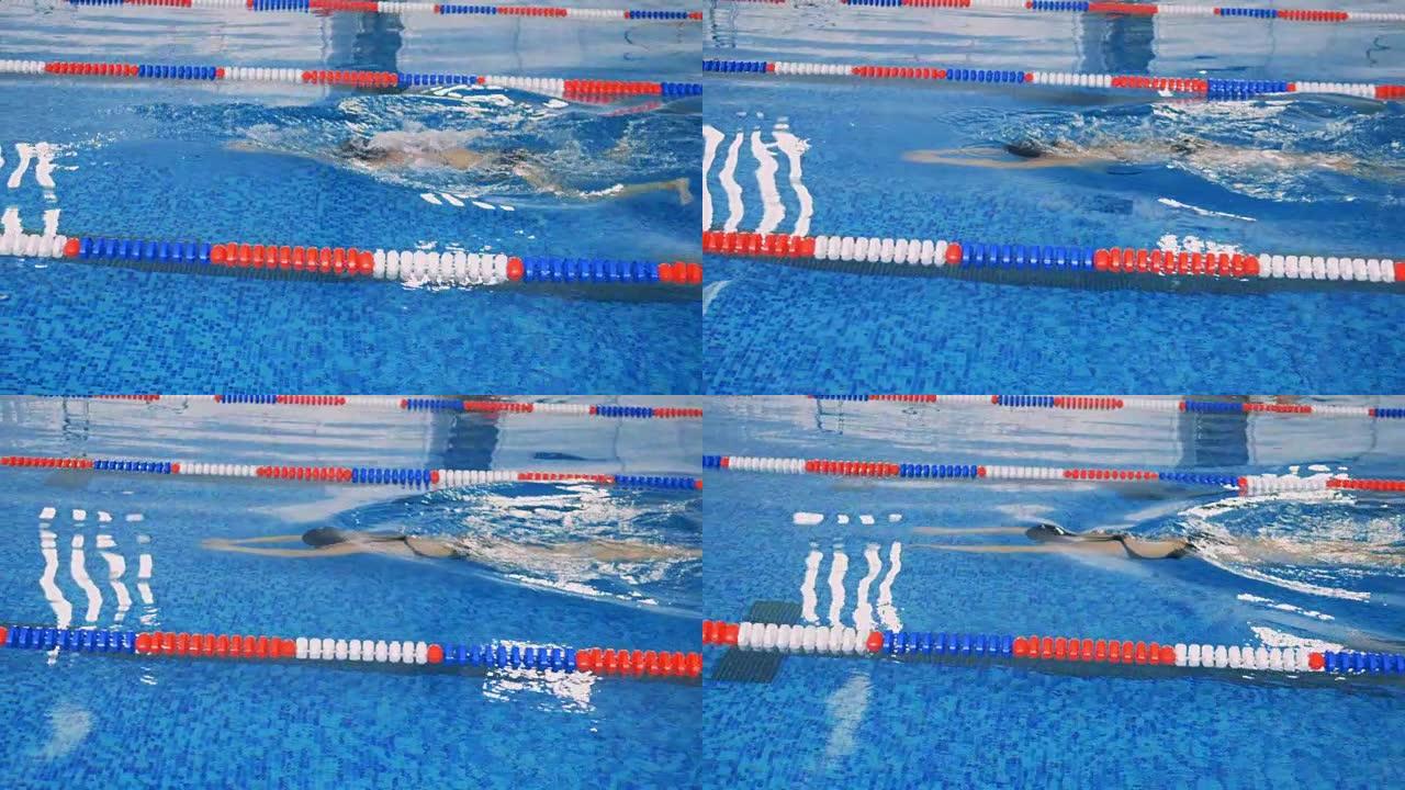 一名女游泳者在水下慢动作。