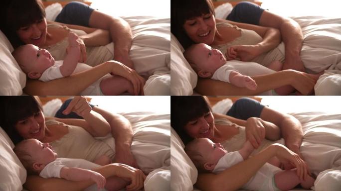 父母躺在床上拥抱宝贝女儿