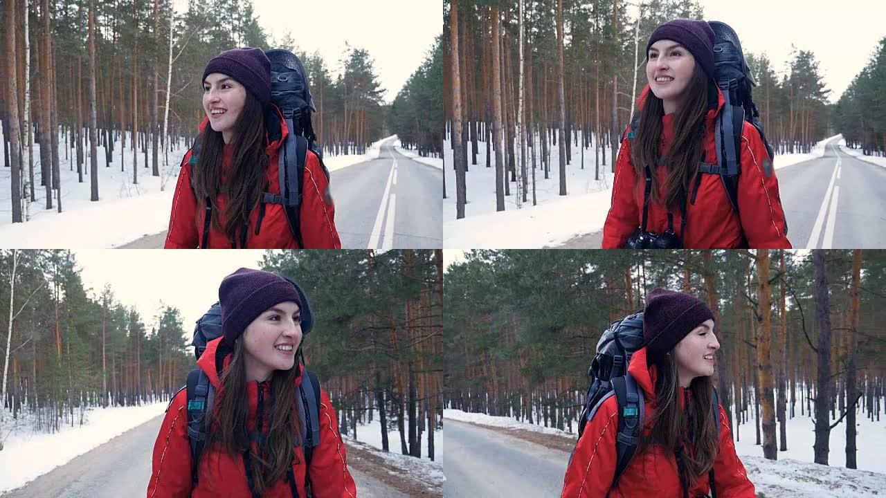 Steadicam拍摄了一名妇女在冬季森林中行走的照片。