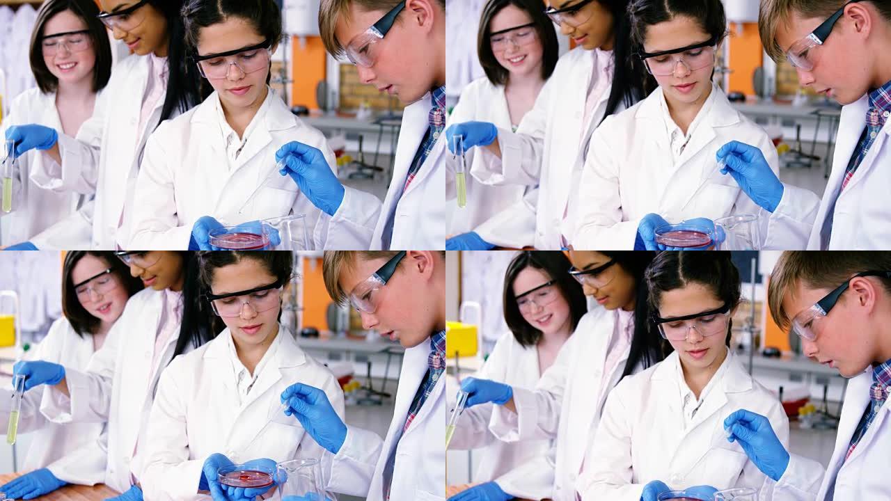 微笑的学校孩子在实验室做化学实验