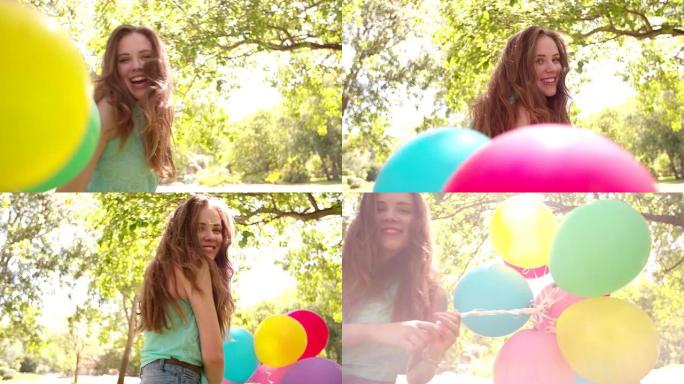 夏天的日子里，一堆气球的女孩