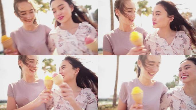 女性最好的朋友在暑假散步和吃冰淇淋