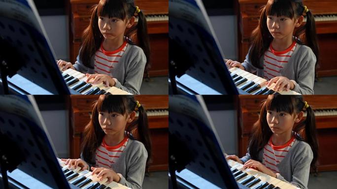 4k音乐课女生学习电钢琴