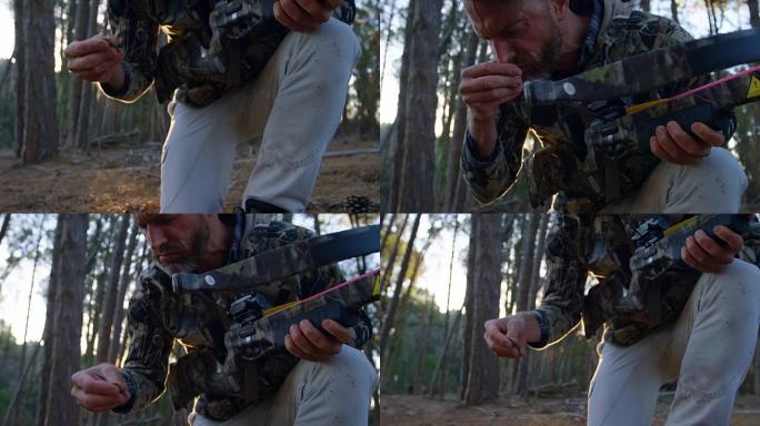 男子在森林中用复合弓瞄准4k