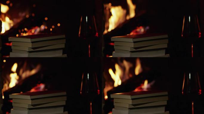 4k红酒和舒适壁炉旁的书堆，慢动作