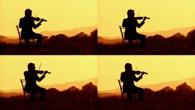 高清: 日落时拉小提琴