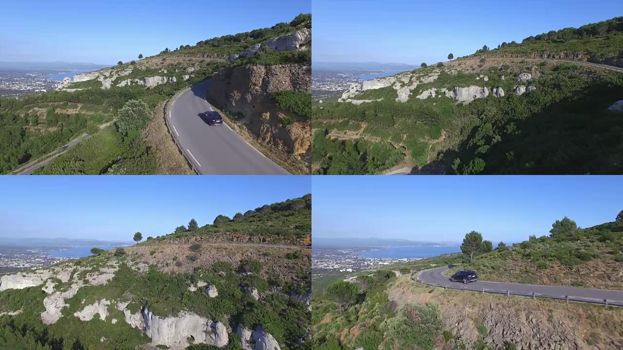 空中: 在法国沿着山路行驶的SUV汽车
