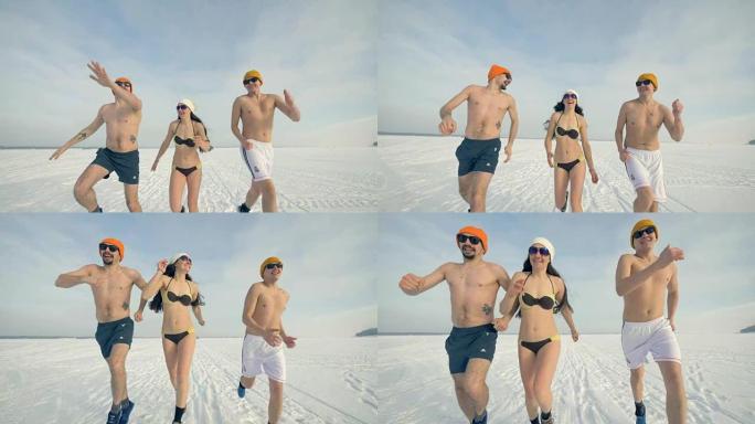 三个运动朋友在冬天穿着泳衣和太阳镜跑步。