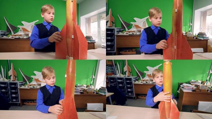 儿童在学校实验室发明了太空火箭模型。