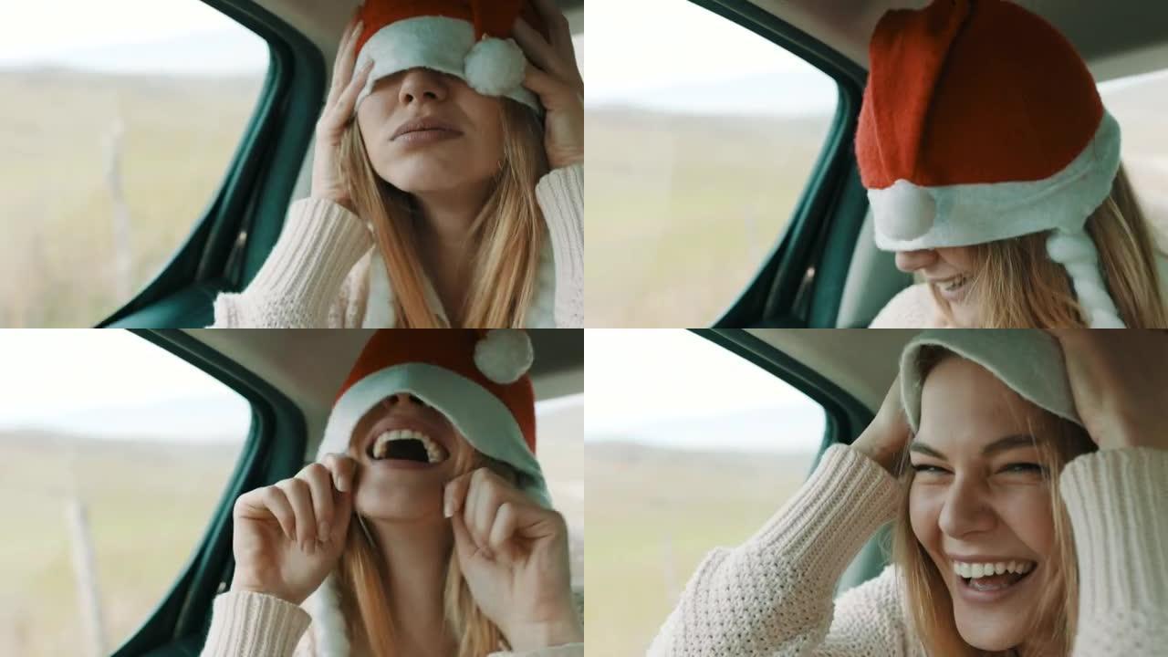 头上戴着圣诞帽的女人在汽车后座上玩得开心