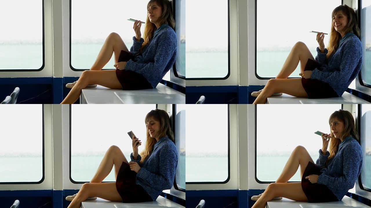 女人在轮渡4k旅行时用手机聊天