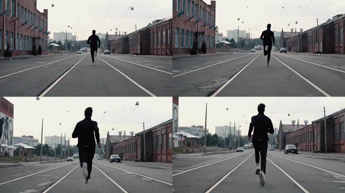 2在1。一个男人在老城的街道上跑得很快。真正的时间。自由的概念。镜头紧跟在年轻运动员身后