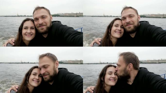 圣彼得堡的爱情。贴心的夫妇，自拍，视点拍摄。恋爱中的幸福情侣，接吻，慢动作
