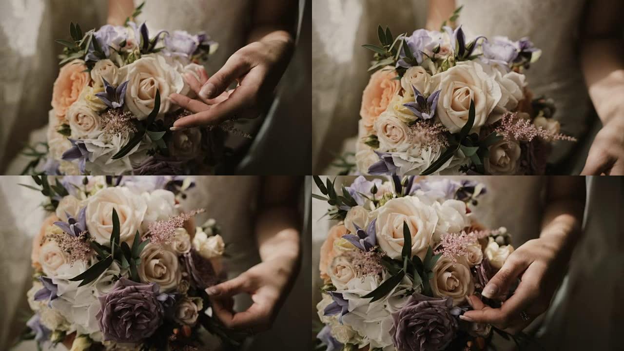 年轻美丽的新娘拿着婚礼花束。仪式前女性触摸鲜花的特写镜头