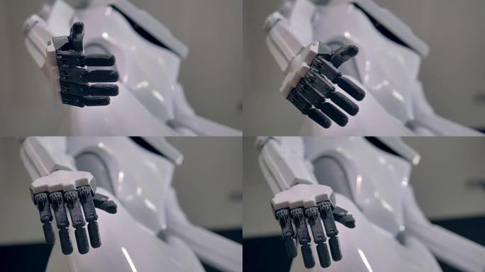 静止的机器人手掌，黑色手指收缩到白色身体。4K。