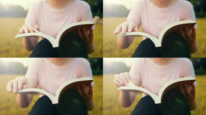 女人在草坪上看书