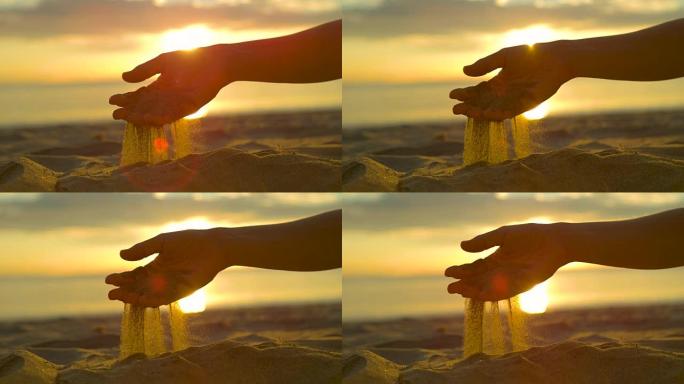 镜头耀斑: 闪闪发光的干沙从无法辨认的女人温柔的手中落下。