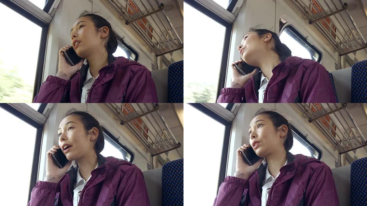 女商人在火车上使用电话