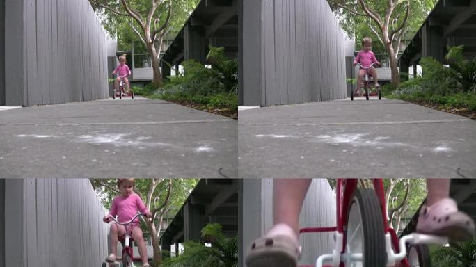 孩子学习骑自行车，对着镜头骑行