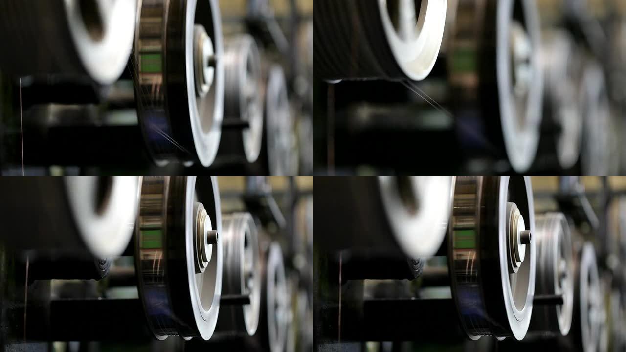 漆包铜线厂轮子转动生产车间特写镜头