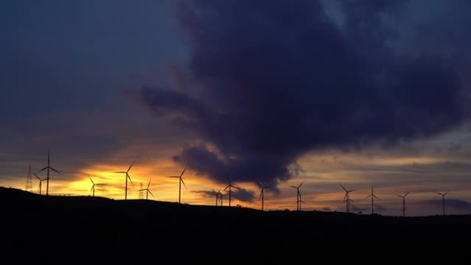 用于替代能源的风力涡轮机农场的4k日落。