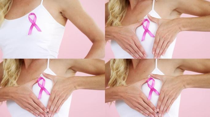 女性中段显示乳腺癌意识丝带