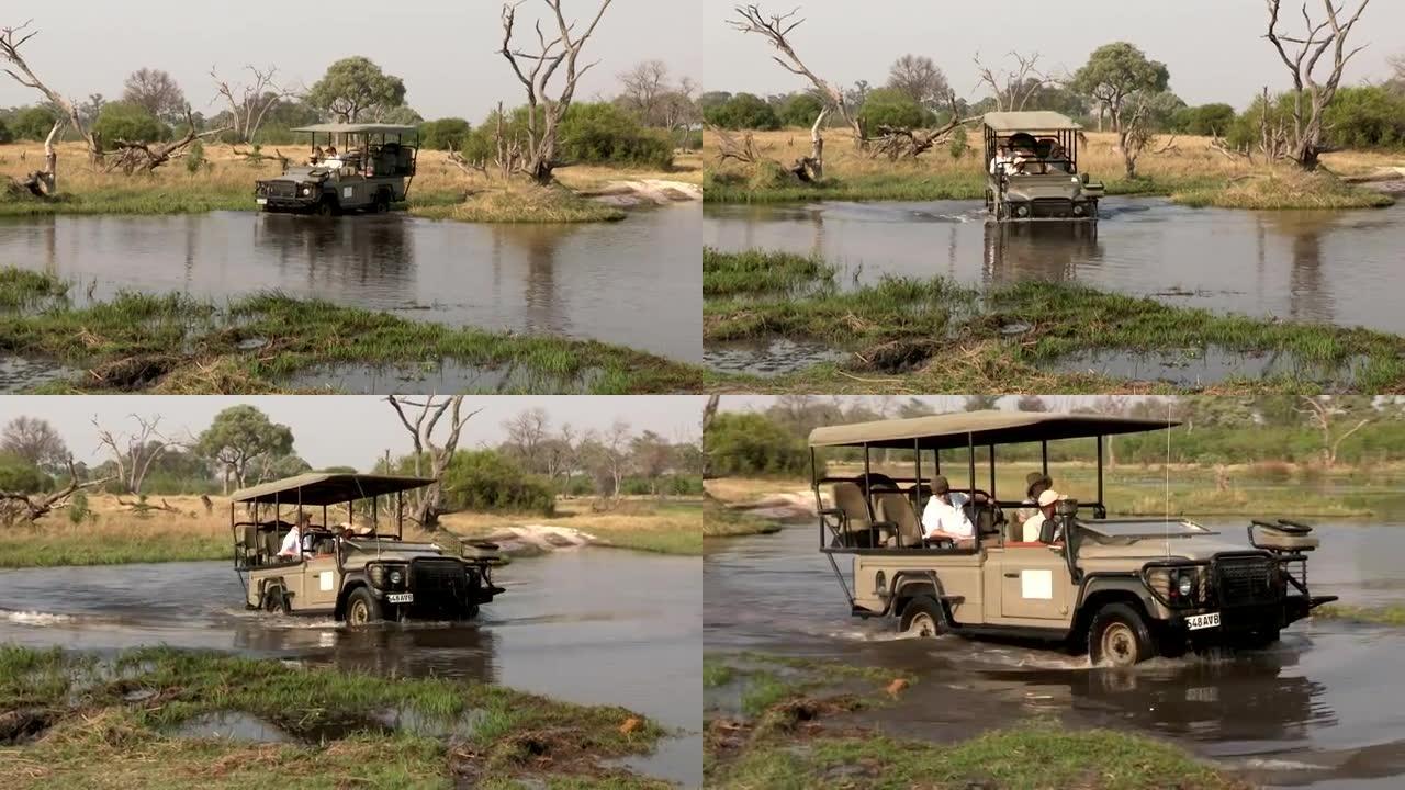 年轻夫妇和狩猎向导乘坐狩猎车穿越博茨瓦纳奥卡万戈河