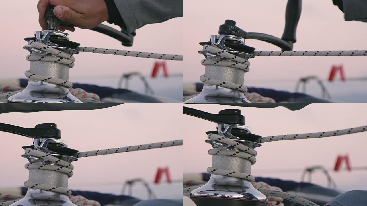 4k人使用曲柄调整帆船索具，慢动作