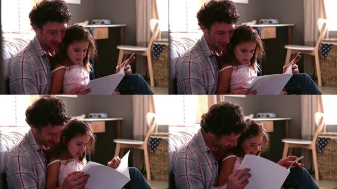 父亲和女儿在孩子的卧室里读书