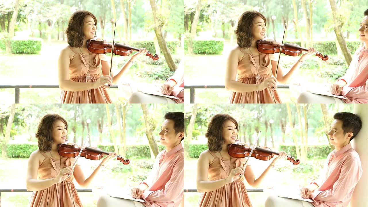 Dolly镜头：亚洲小提琴手拉小提琴，男友在听