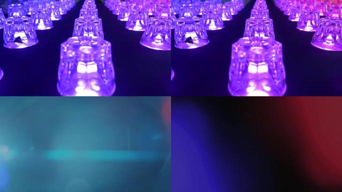 抽象运动背景，闪亮的灯光，能量波和闪闪发光的粒子。迪斯科灯音乐会聚光灯灯泡。
