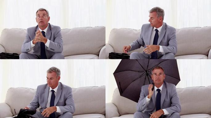 商人坐在沙发上打开雨伞