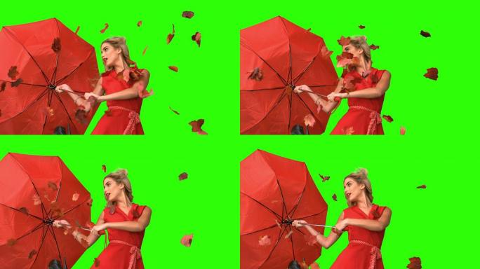 漂亮的魅力女人在绿色屏幕上拿着一把破雨伞