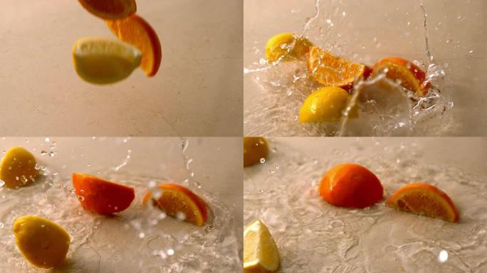 橙色和柠檬碎片落在潮湿的白色表面上