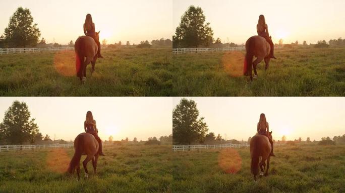 慢动作: 漂亮的金发微笑女孩光着背朝着夕阳骑行