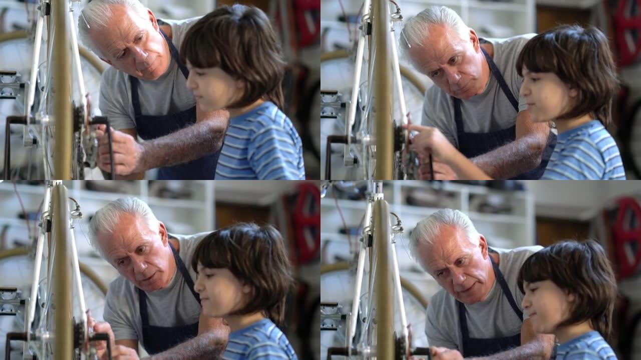 慈爱的祖父教他的孙子如何在自行车上进行保养
