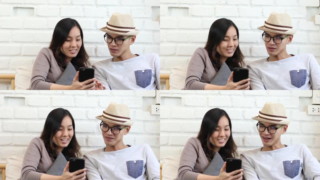 幸福的夫妇使用手机进行互联网购买
