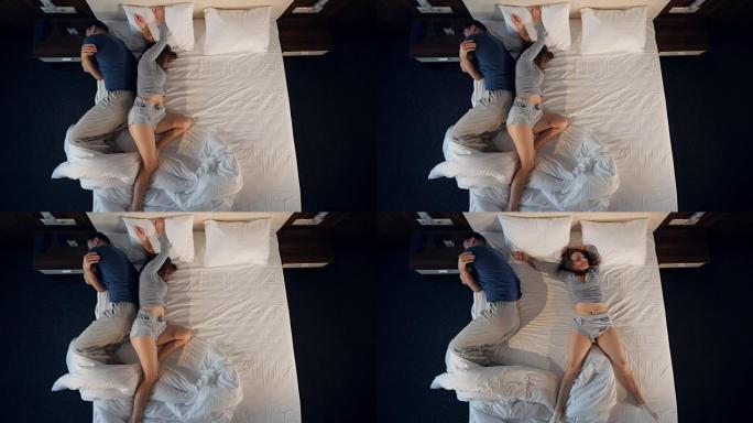 有趣的女人在一张床上辗转反侧时让男人流离失所。4K。