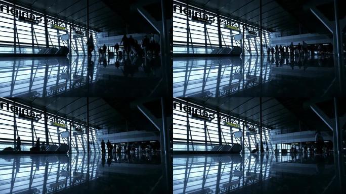 旅客在机场的剪影落地窗倒影反光出发出行