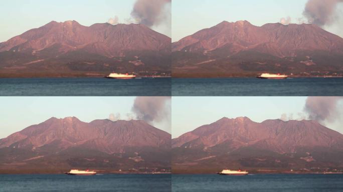 高清：樱花岛活火山和日落时的渡轮