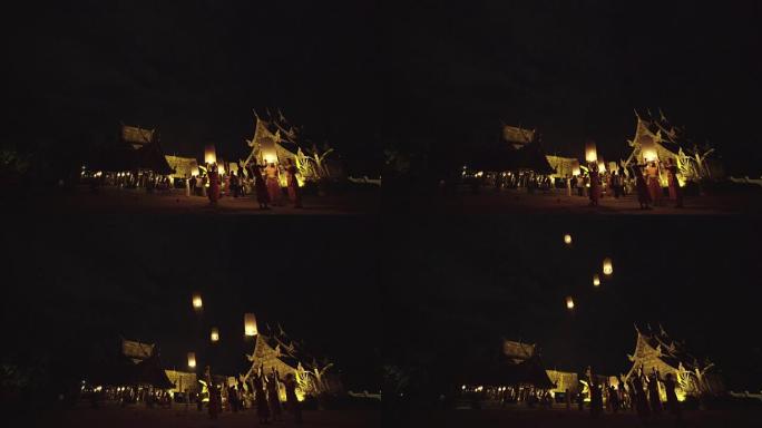 在Loi kathong传统节日中，离家不明的和尚带着天灯。