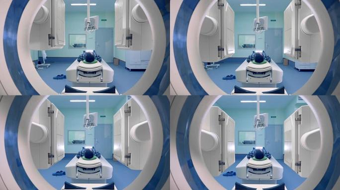 断层扫描面板在一个人周围移动。病人接受磁共振成像，医学检查。